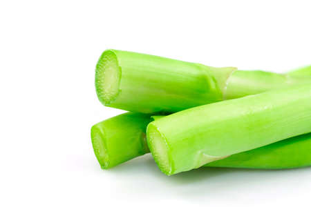 The cut head of fresh organic green asparagus isolated on white background.の写真素材