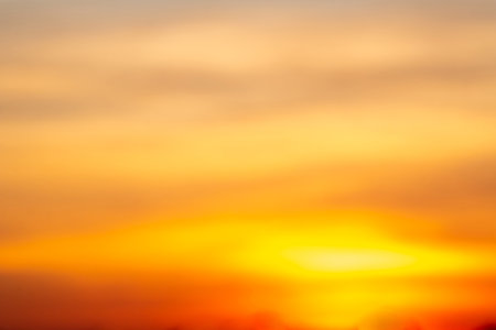 Beautiful of luxury soft gradient orange gold clouds and sunlight on the blue sky perfect for the...