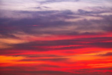 Beautiful of luxury soft gradient orange gold clouds and sunlight on the blue sky perfect for the background, take in everning,Twilightの写真素材