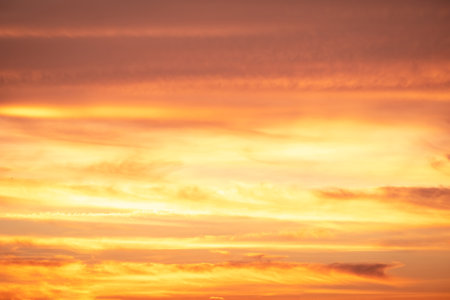 Beautiful , luxury soft gradient orange gold clouds and sunlight on the blue sky perfect for the background, take in everning,Twilight, Large size, high definition landscape photoの写真素材