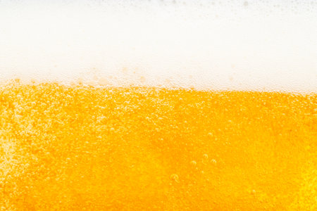 Close up bright orange Oil or beer splash texture and nature waves, Beautiful waves curve and little...