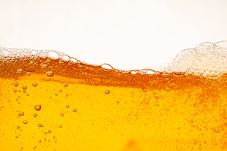 Close up bright orange splash texture and nature waves, Beautiful waves curve and little bubbles smooth for graphic design and background, Soft bubbles, Selective focusの写真素材