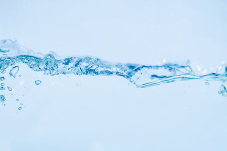Water splash isolated on white background, Air Bubbles Float Up Under Blue Water. Pure Water Wave,...
