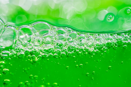 Water wave, close up of vibrant green liquid with bubbles, capturing dynamic movement and freshness....