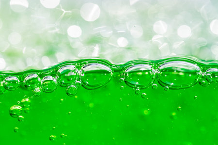 Water wave, close up of vibrant green liquid with bubbles, capturing dynamic movement and freshness. Perfect for backgrounds, beverages, or abstract concepts. soft drinkの写真素材
