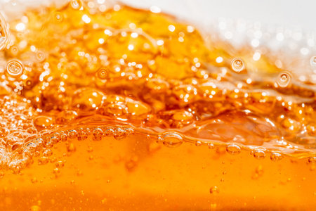 Close up bright orange splash texture and nature waves, Beautiful waves curve and little bubbles smooth for graphic design and background, Soft bubbles, Selective focusの写真素材