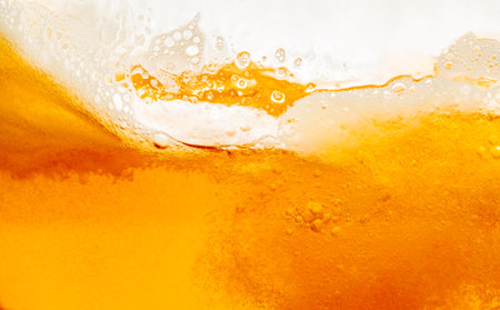 Close up bright orange Oil splash texture and nature waves, Beautiful waves curve and little bubbles smooth for graphic design and background, Oil Bubbles, Soft bubbles, Selective focusの写真素材