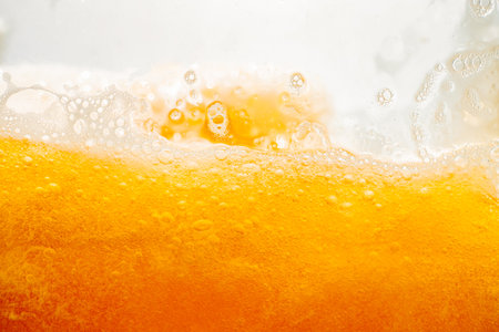 Close up bright orange liquid splash texture and nature waves, Beautiful waves curve and little...