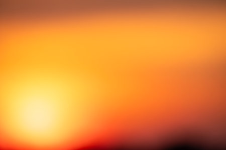 Beautiful soft gradient orange gold clouds and sunlight on the blue sky perfect for the background, take in evening,Twilight, Large size, high definition landscape photo, savanna viewの写真素材