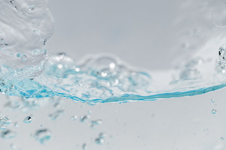 Closeup Transparent blue clear water surface texture with ripples. Abstractâ€‹ ofâ€‹...