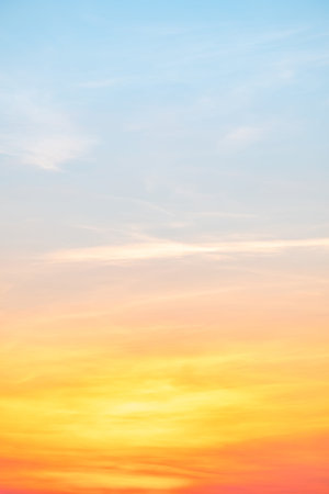 Beautiful sunrise sky with vibrant gradient orange and gold colors and soft blue, Clear atmosphere...