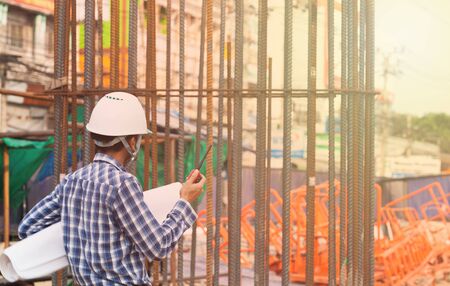 engineer checking progress of construction site,engineer working on checking progress of construction siteの写真素材