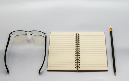 Book Pencil Glasses On white background.の写真素材