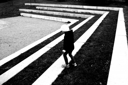 Girl walking on the white and black stripesの写真素材