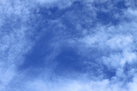 clouds in the sky drifting away in a light breeze