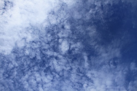 clouds in the sky drifting away in a light breezeの写真素材