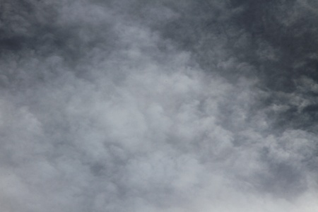 clouds in the sky drifting away in a light breeze