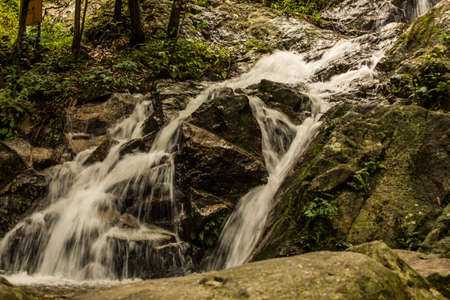 Beautiful small waterfall in rain forest at Maekampong, Chiang Mai, Thailand.の写真素材