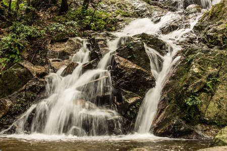 Beautiful small waterfall in rain forest at Maekampong, Chiang Mai, Thailand.の写真素材