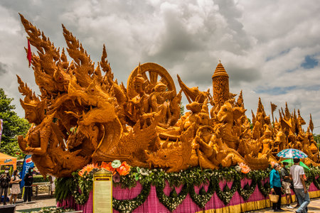 Ubonratchathani, thailand - july 15: beuatiful candle wax carving thai style in the traditional parade active festival buddhist lent on july 15, 2022, ubonratchathani, thailandのeditorial素材