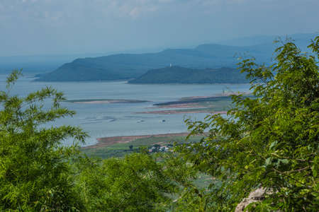 Nature backgrounds/Dramatic clouds and river with mountain and tree: Hin chang si view piont at Nam phong national park khon kaen province Thailand.の写真素材