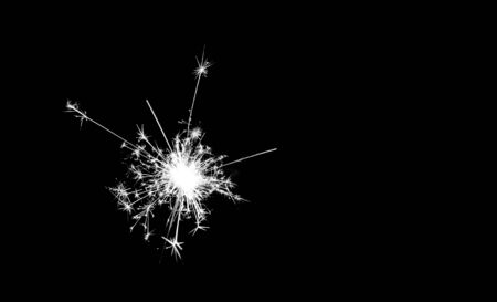 New year party sparkler on black backgroundの写真素材