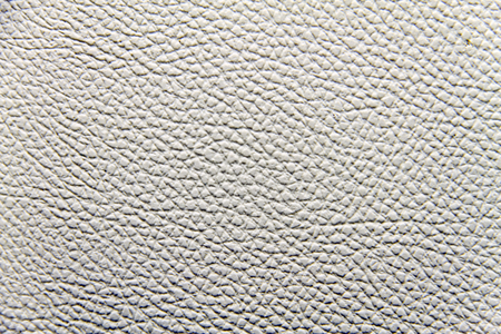 old white leatherette texture as backgroundの写真素材
