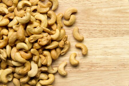 cashew nuts on a wooden floorの写真素材