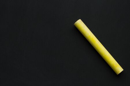 Yellow chalk on a blackboard.