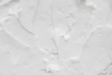 Cosmetics. Cream white background texture.の写真素材