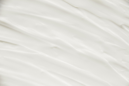 Cosmetics. Cream white background texture.の写真素材
