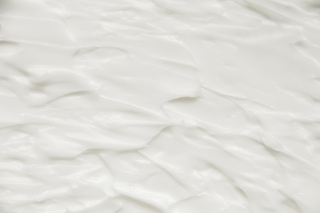 Cosmetics. Cream white background texture.の写真素材