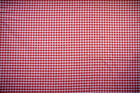 Red classic checkered tablecloth texture, background with copy space