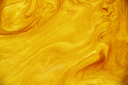 Golden acrylic background texture.の写真素材