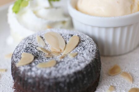 Sliced almonds on a chocolate cake.