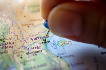 Hand pin on the map of Hanoi, Vietnamの写真素材