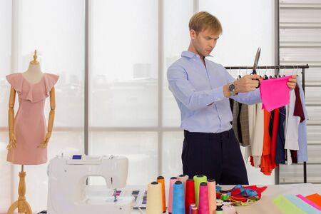 A professional male designer in a sewing roomの写真素材