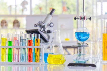 Chemical reagents in glass bottles of various shapes, scientific experiments of various sizes.の写真素材