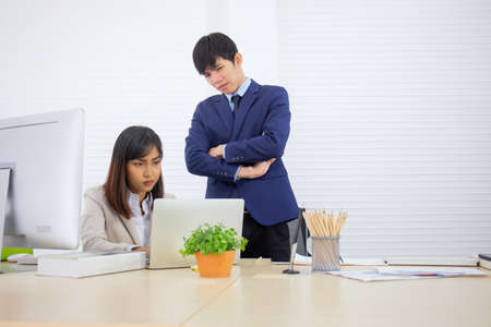 Asian business women and men are sitting in the officeの写真素材