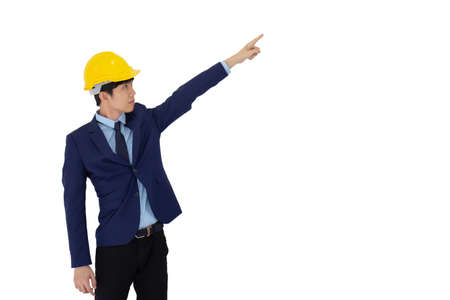 A young Asian foreman wears a yellow helmet isolated on white background.