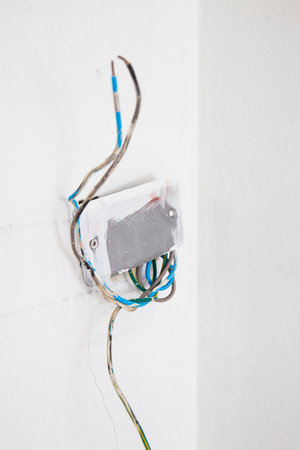 unfinished power socket on the wall