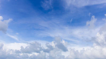 Cloudy sky wallpaper dark blue sky with full white clouds and sunlight.