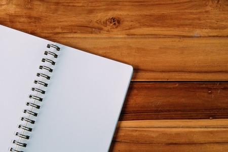 Blank notepad on office wooden tableの写真素材