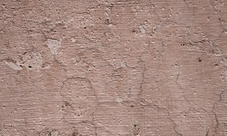 Texture of old rustic wall covered with pink stucco. Abstract background for design.の写真素材