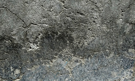 Background texture of concrete wall with cracks and scratches which can be used as a backgroundの写真素材