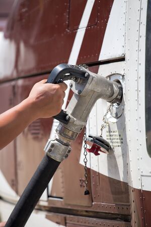 hand hold fuel nozzle to helicopter
