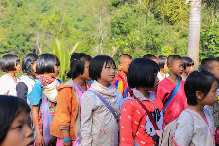 Tak, Thailand-Jan 16: Karen children stand in line at border primary school on Jan 16, 2015 in Tha Song Yang, Tak, Thailand. School located in mountain near Thailand-Myanmar border for help and study Ethnics childrenのeditorial素材