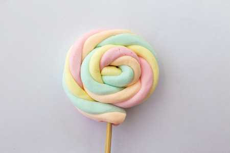 multicolor jelly twist and roll stick with sugar isolated on white backgroundの写真素材