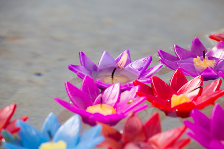group of artificial flower candle floating on water