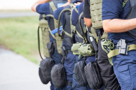 law enforcement training team with tactical equipment and tactical movement in academyの写真素材